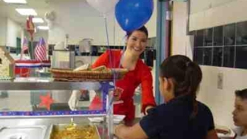 Marcy Martinez, Sheriff Lupe Trevino serve lunch KGBT