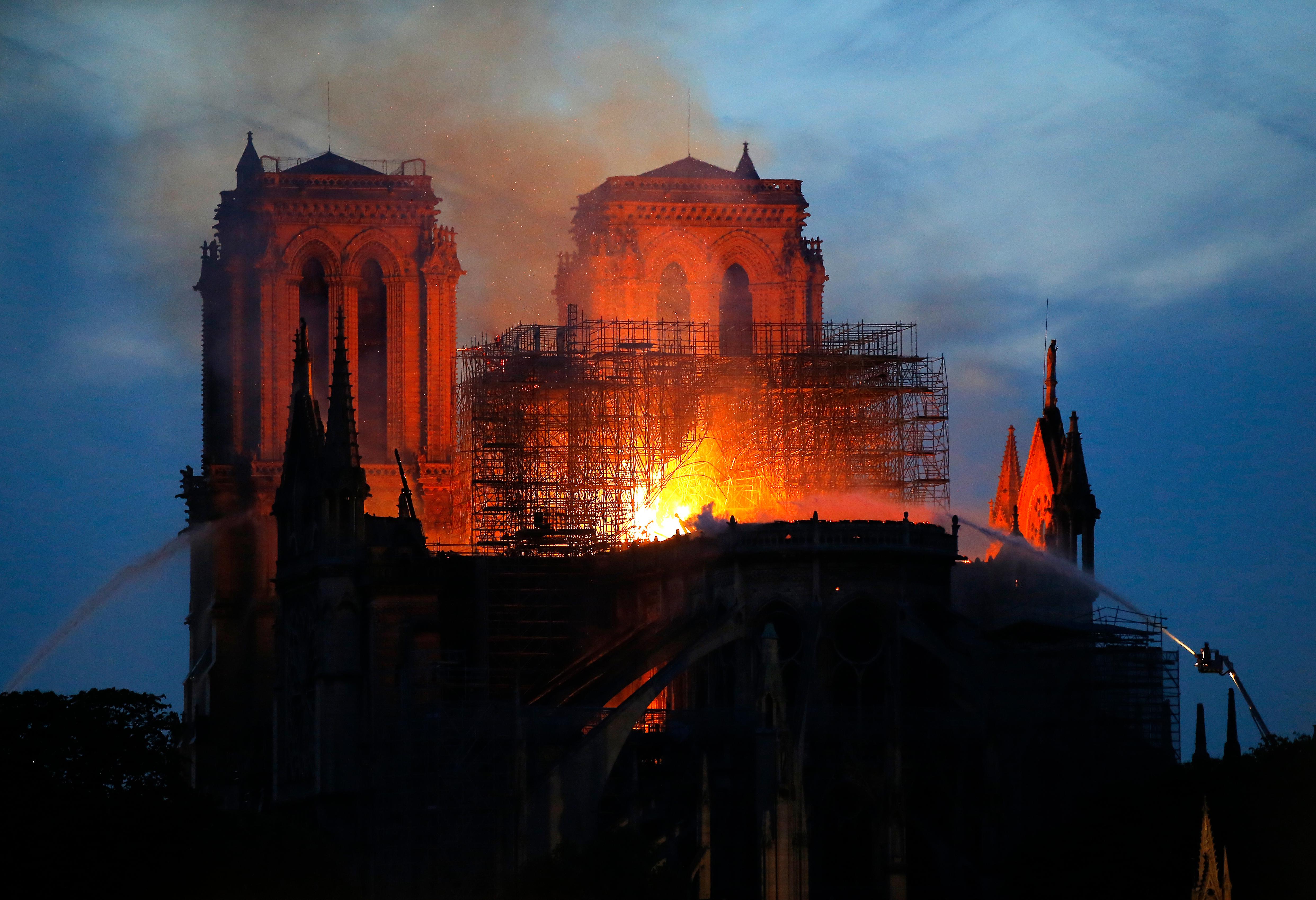 live: massive fire engulfs beloved notre dame cathedral in paris